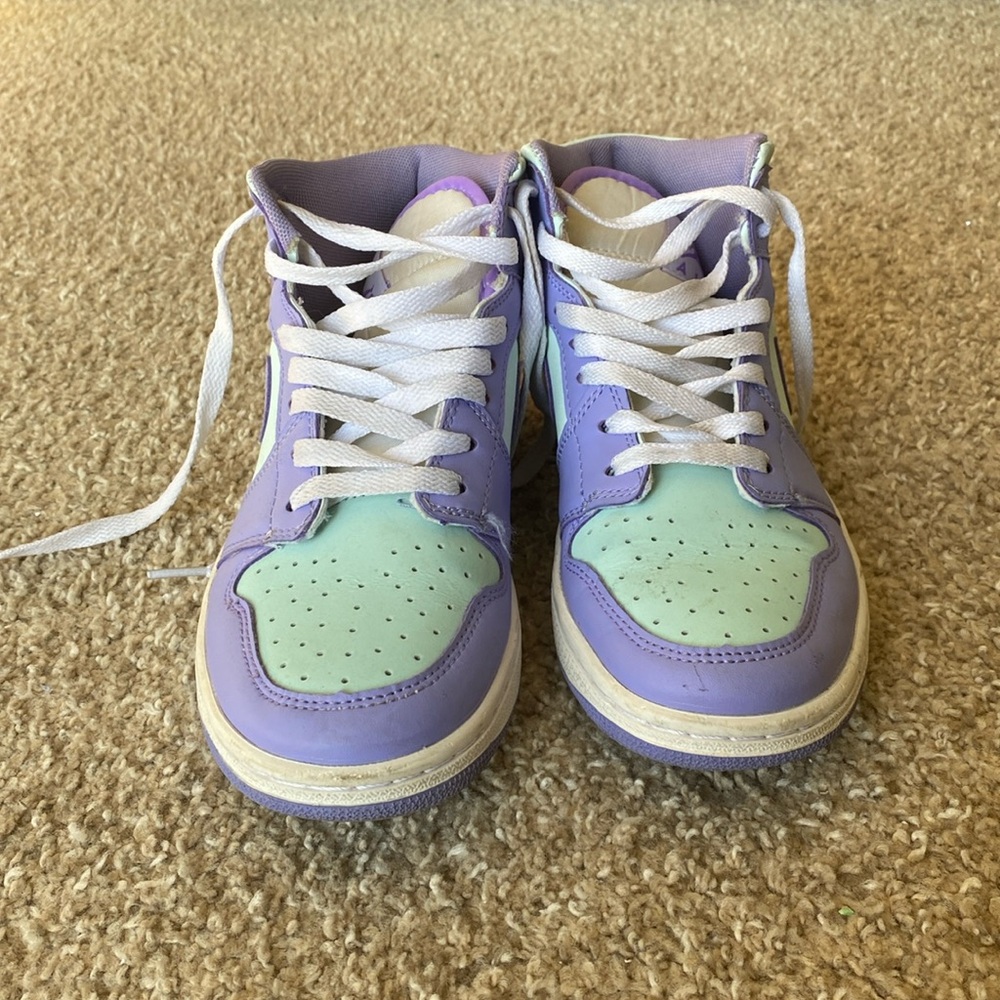 Purple and teal air Jordans.